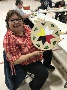 Marie Pictou displays her drum project.